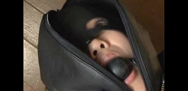  Ballgagged asian girl tied into a leather sleepsack teased and vibed